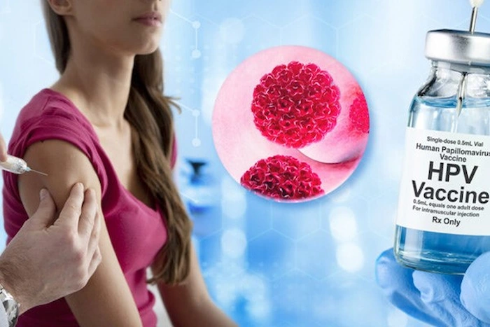 تزیریق واکسن HPV به بازوی دختر جوان 6878651